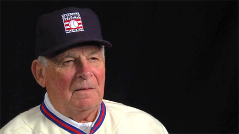 Photo shows Bobby Cox speaking in a 2013 interview with the Baseball Hall of Fame after his induction.