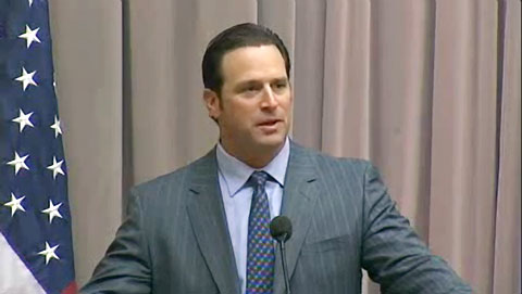 Photo shows Mike Matheny speaking about how to build great teams.